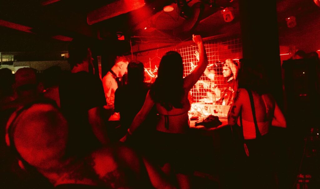 Crowd dancing at a techno party in Zicatela