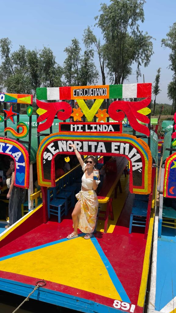 Guests dancing to their own music during a private trajinera party